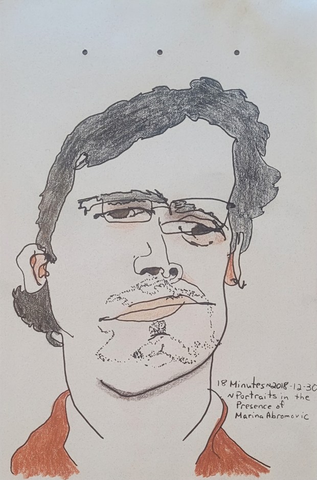 Sketch of a man with glasses and slight beard